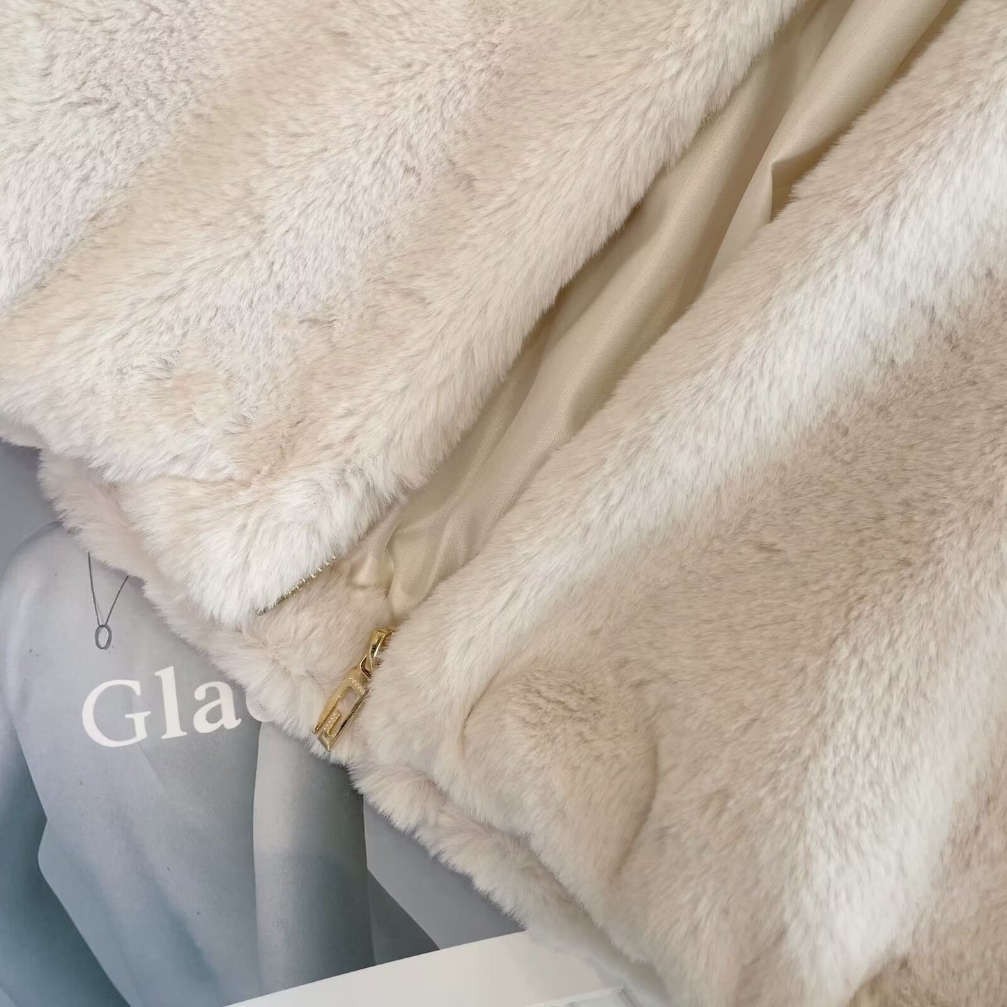 Women's artificial fur effect high neck hooded sleeveless vest