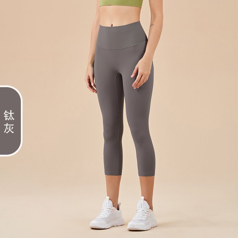 Ladies' New High-waisted Cropped Trousers Yoga Pants with No Embarrassment, Back Pocket Peach Hip-lifting Exercise Pants.