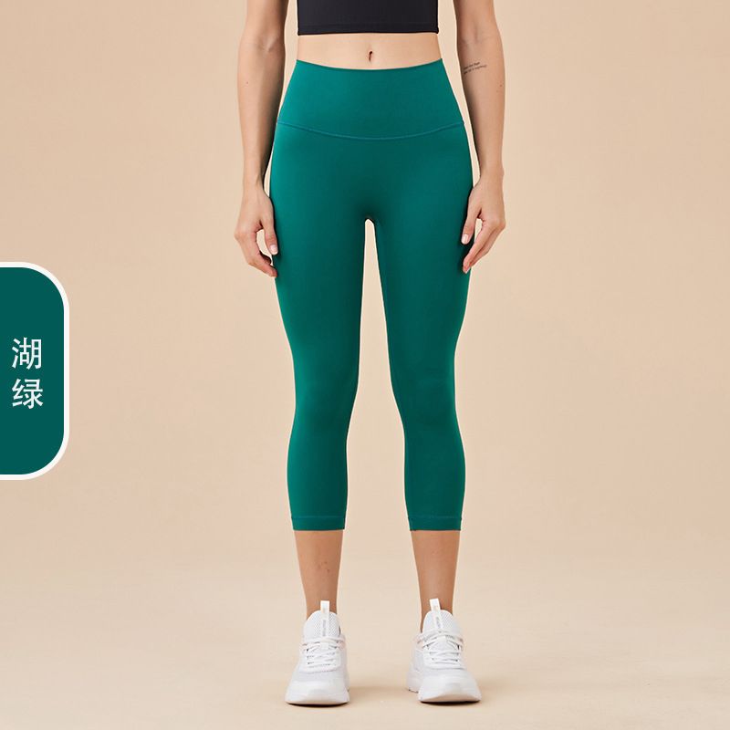 Ladies' New High-waisted Cropped Trousers Yoga Pants with No Embarrassment, Back Pocket Peach Hip-lifting Exercise Pants.